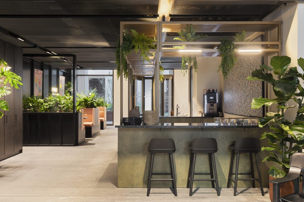 Communal kitchen space inside Myo Bankside with bar-stool seating.