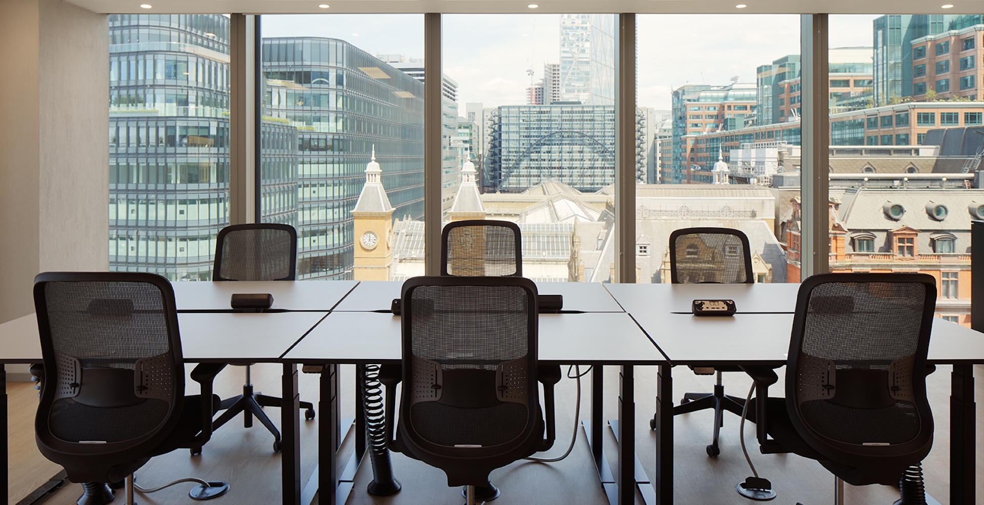 A London skyline visible from the windows of Myo's Liverpool Street offices